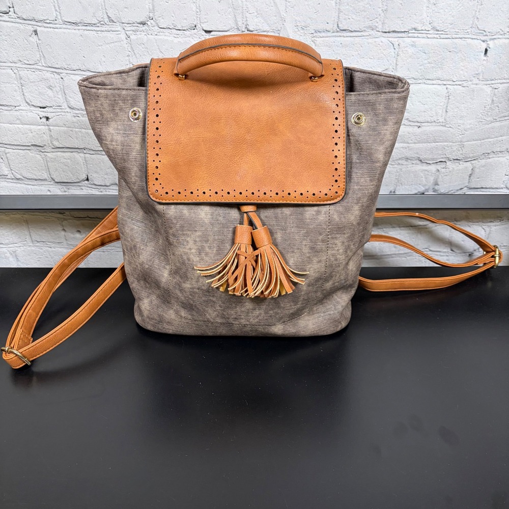 Womens Faux Leather Tassel Backpack Grey Tan Perforated Flap Bag